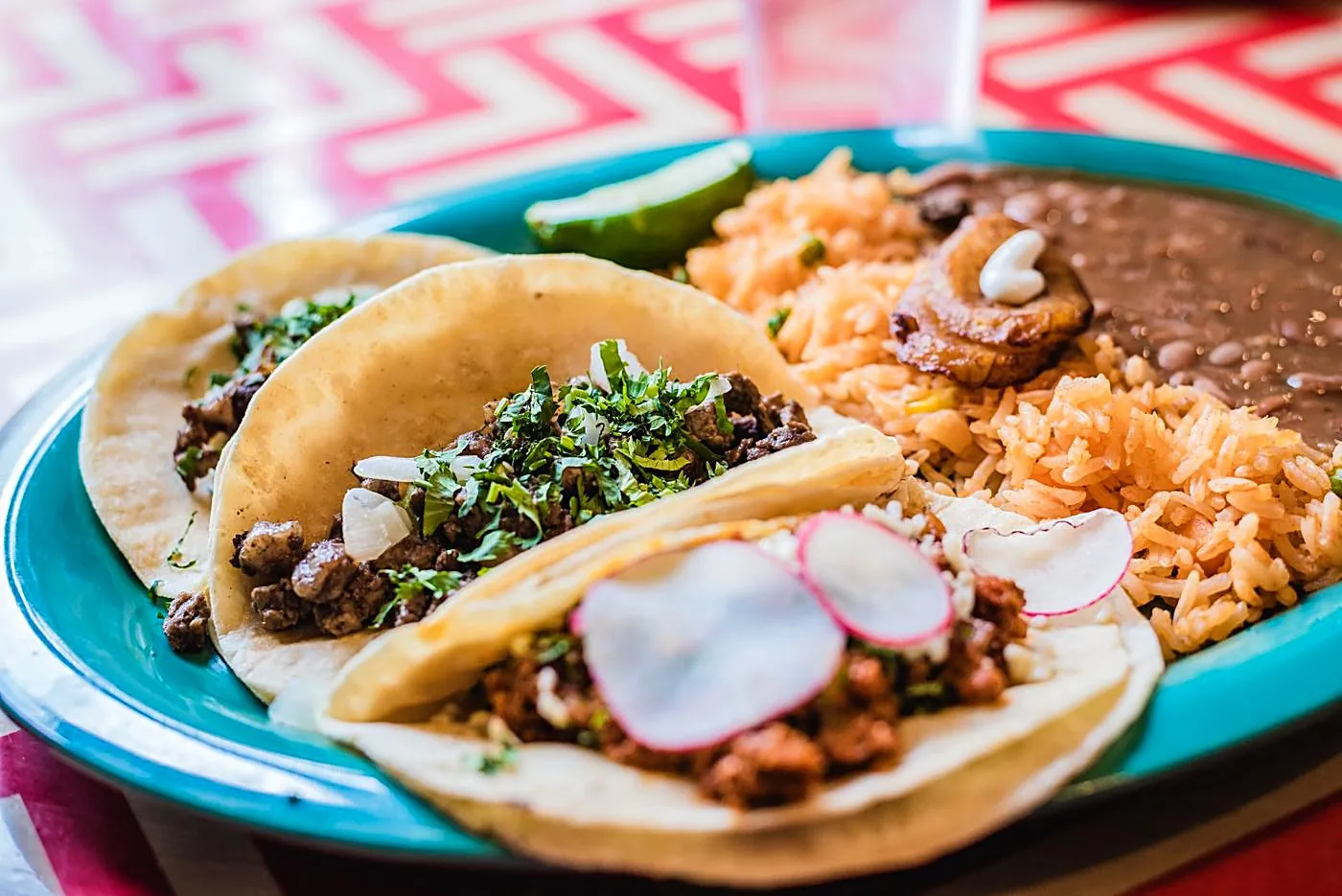 Grilled beef fajita street tacos with cilantro, onion and radish, off the flat-top